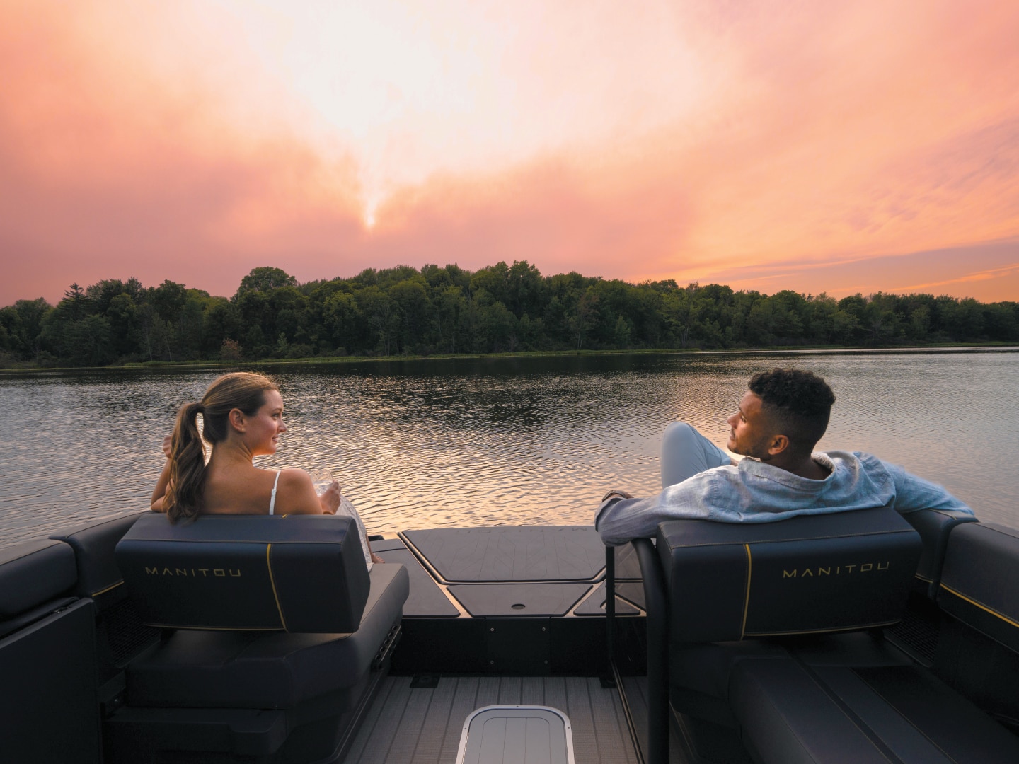 Couple watching the sunset on their MAX deck
