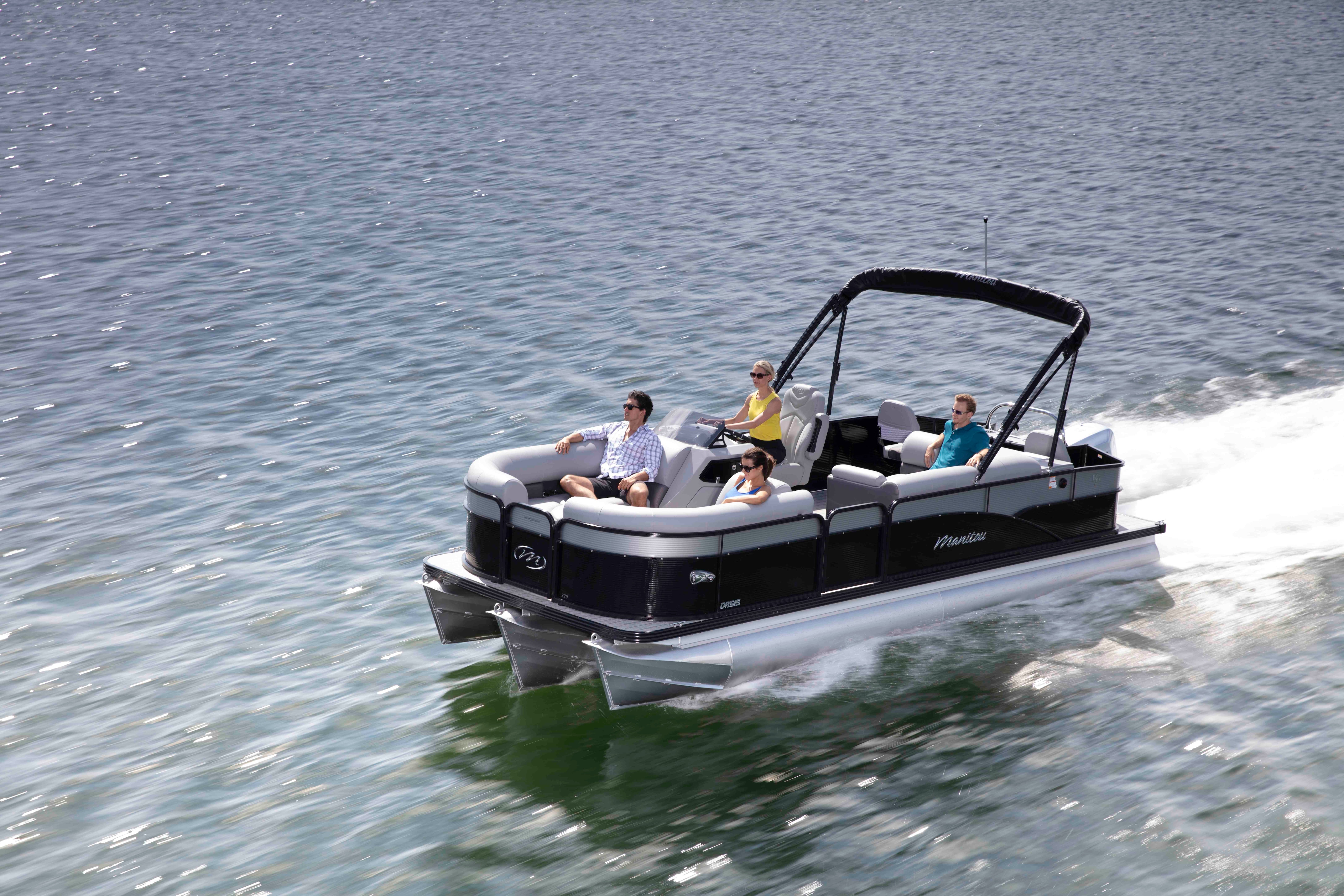 Manitou Oasis Angler Pontoon Boat cruising fast