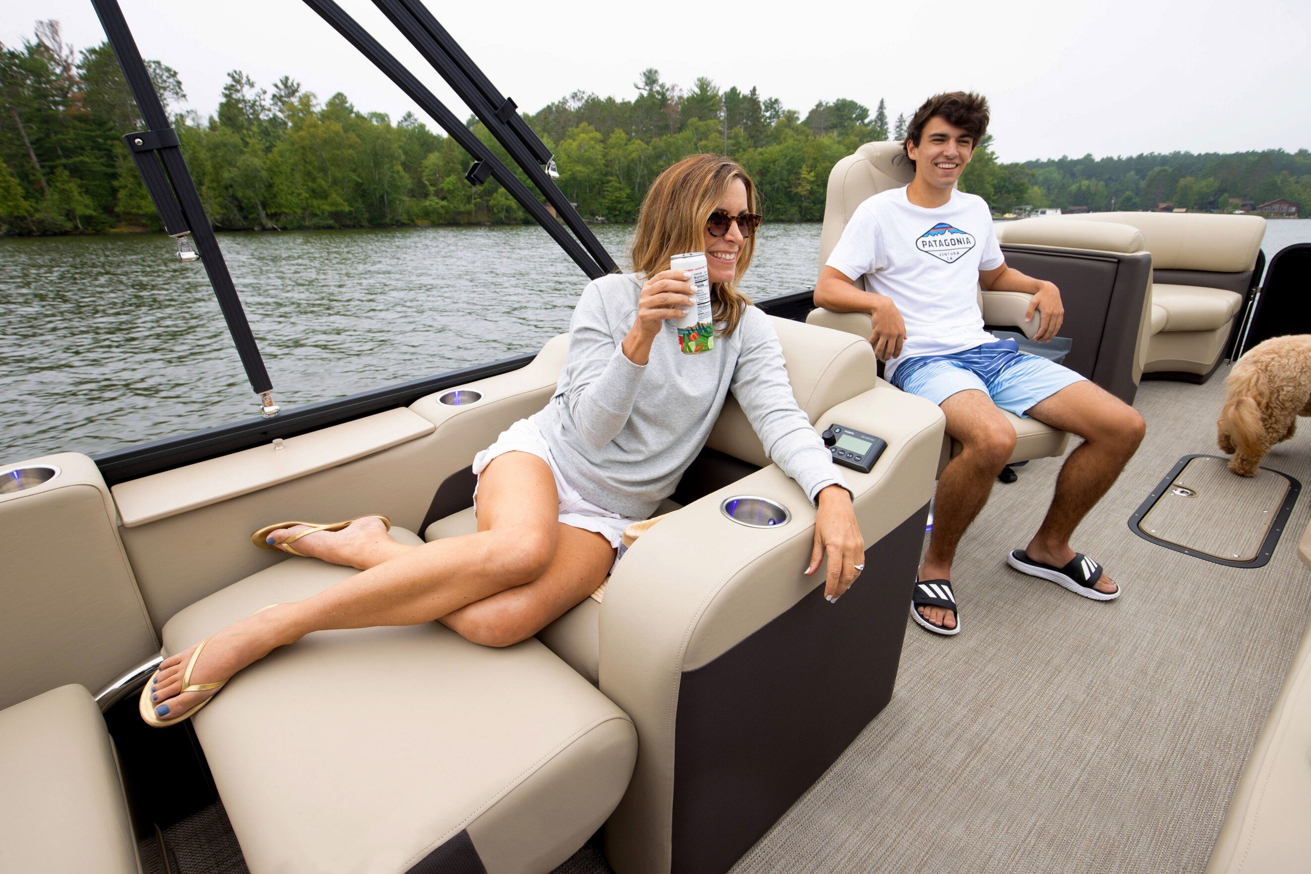 Girl using Manitou Oasis Pontoon Boat Cup holders