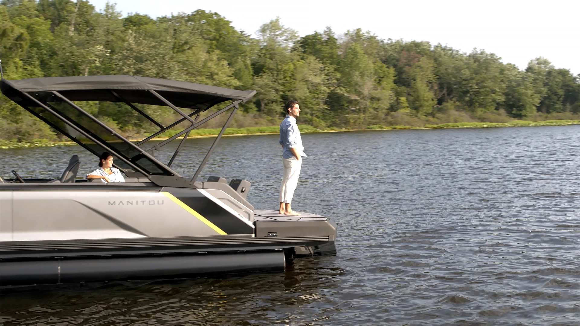 Man standing on his MAX deck looking at the lake