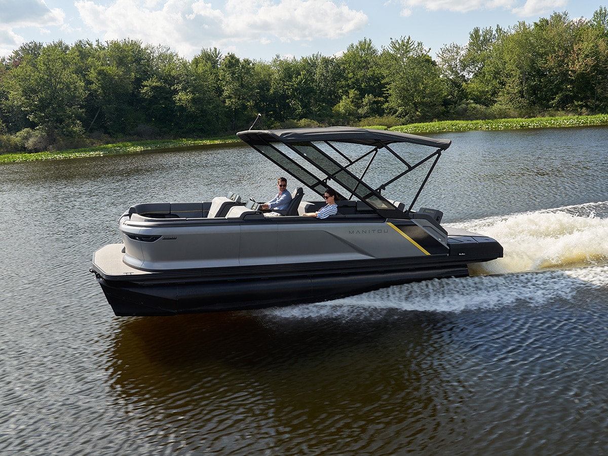 Passengers enjoying a ride on their 2023 Manitou Explore Pontoon boat