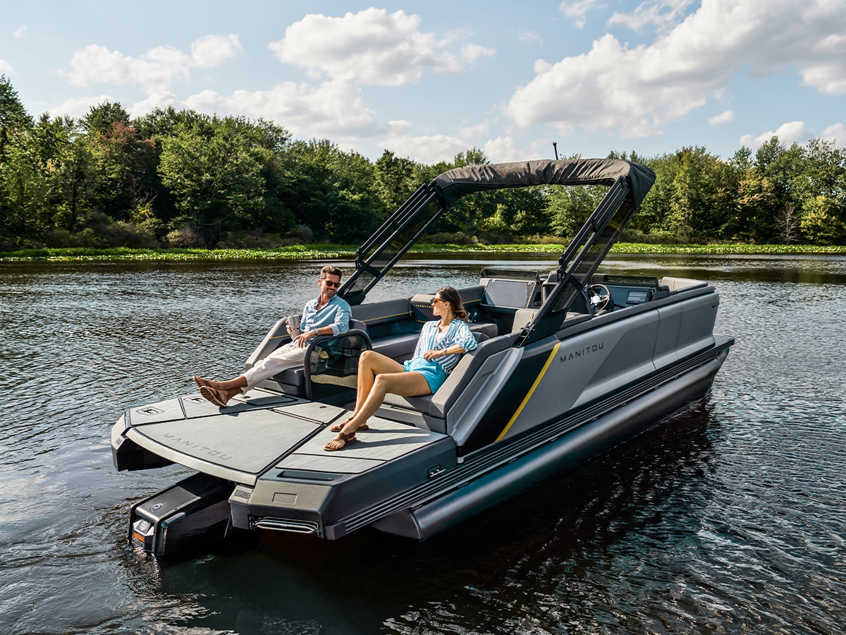 Couple relaxing on a 2023 Manitou Explore