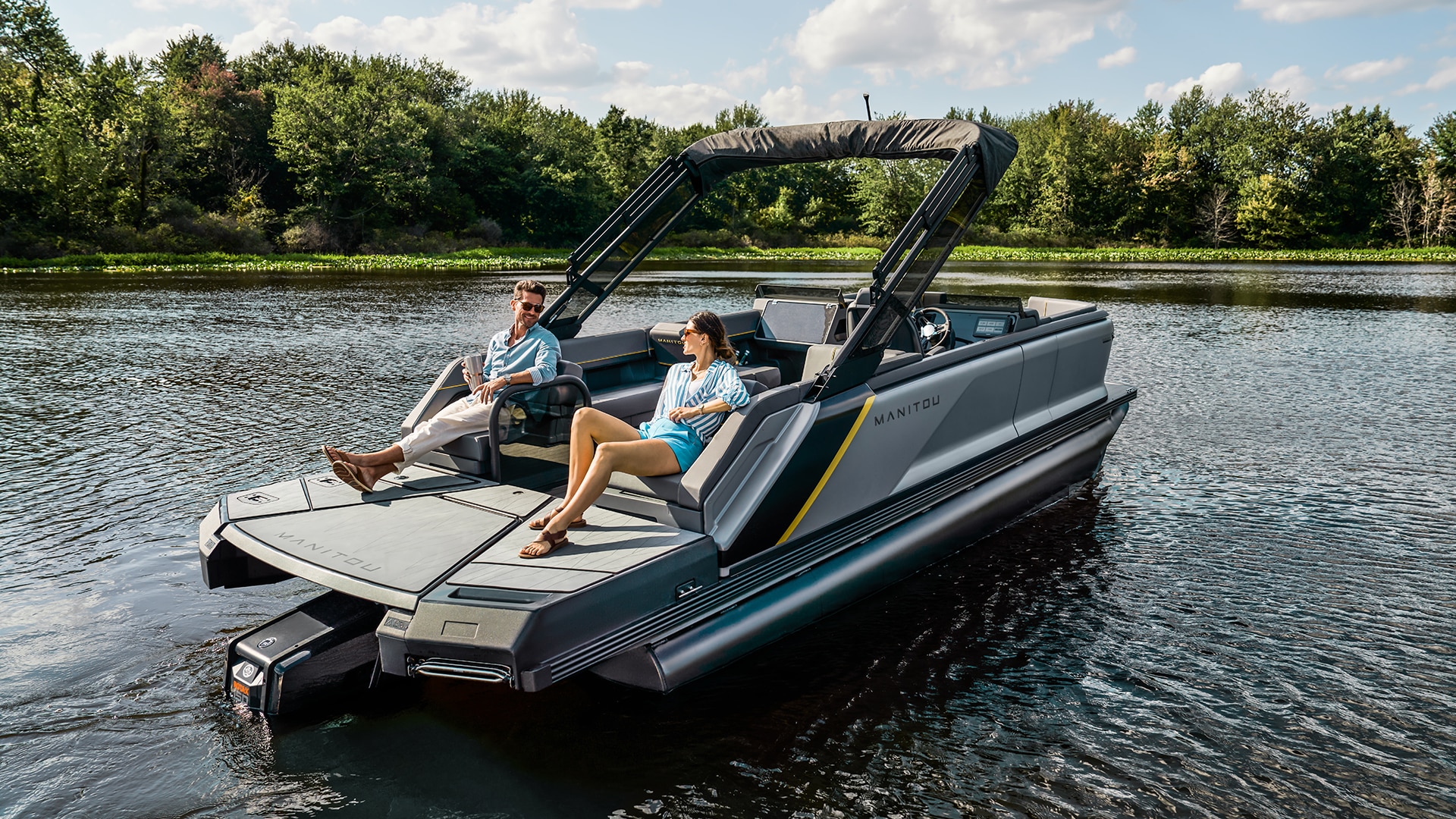 Passengers lounging on a 2023 Manitou Explore pontoon boat
