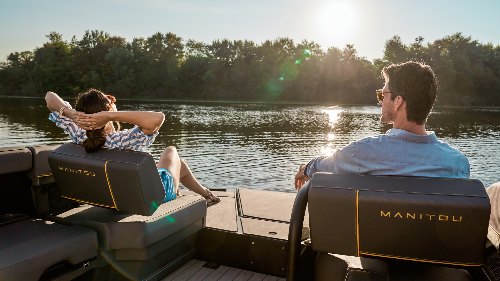 People enjoying a peaceful ride on a 2023 Manitou Explore Pontoon Boat