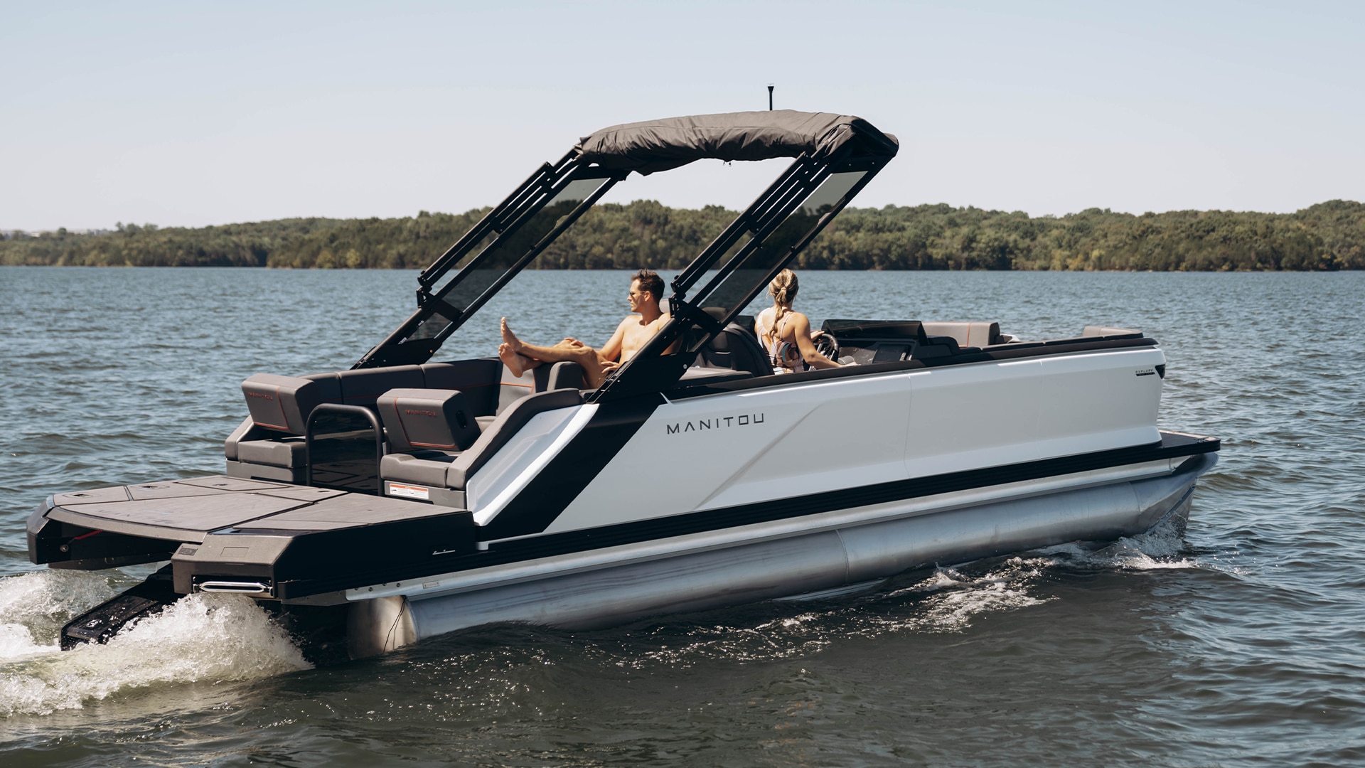 Friends having fun on a Manitou pontoon boat