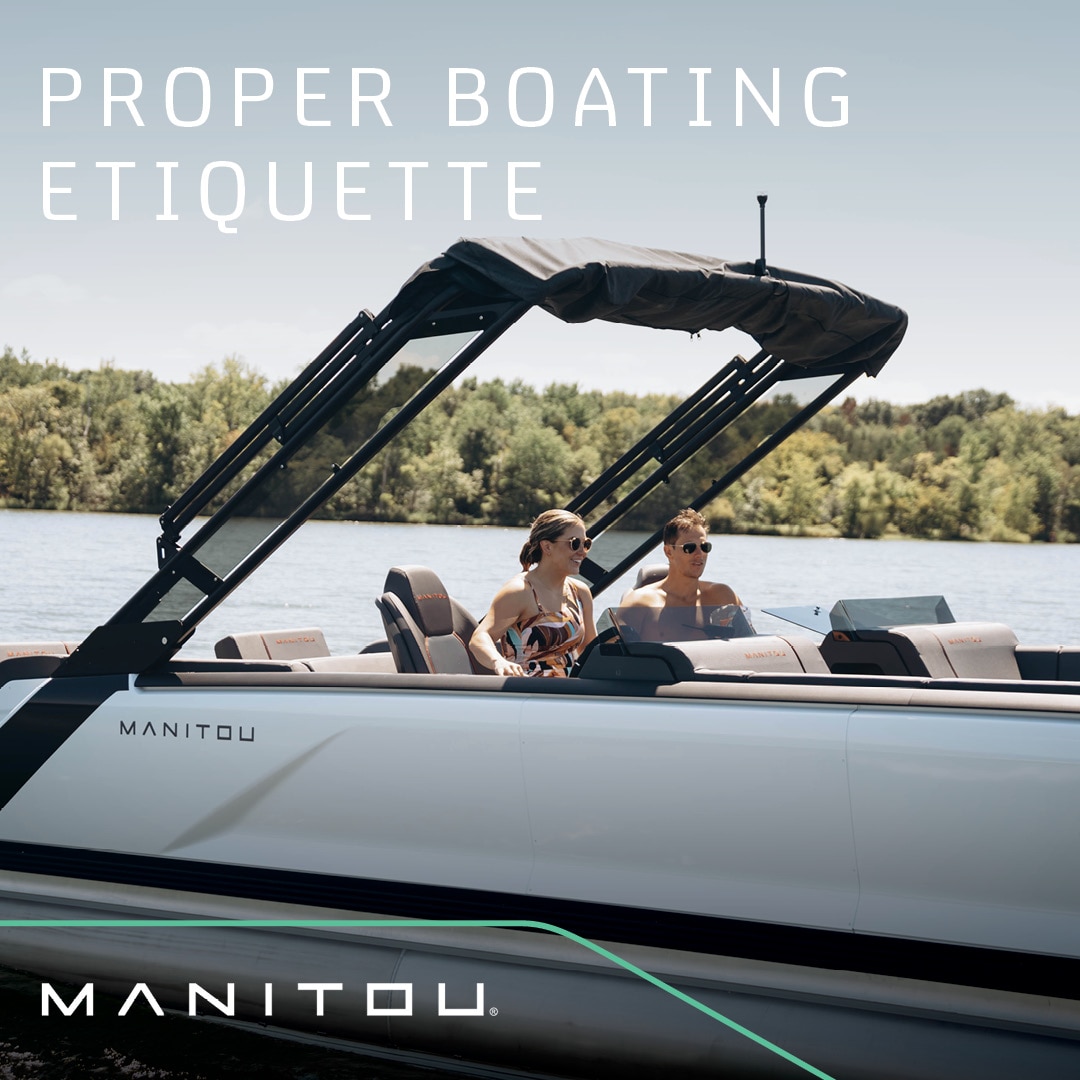 a couple enjoying a Manitou Explore ride following boating etiquette