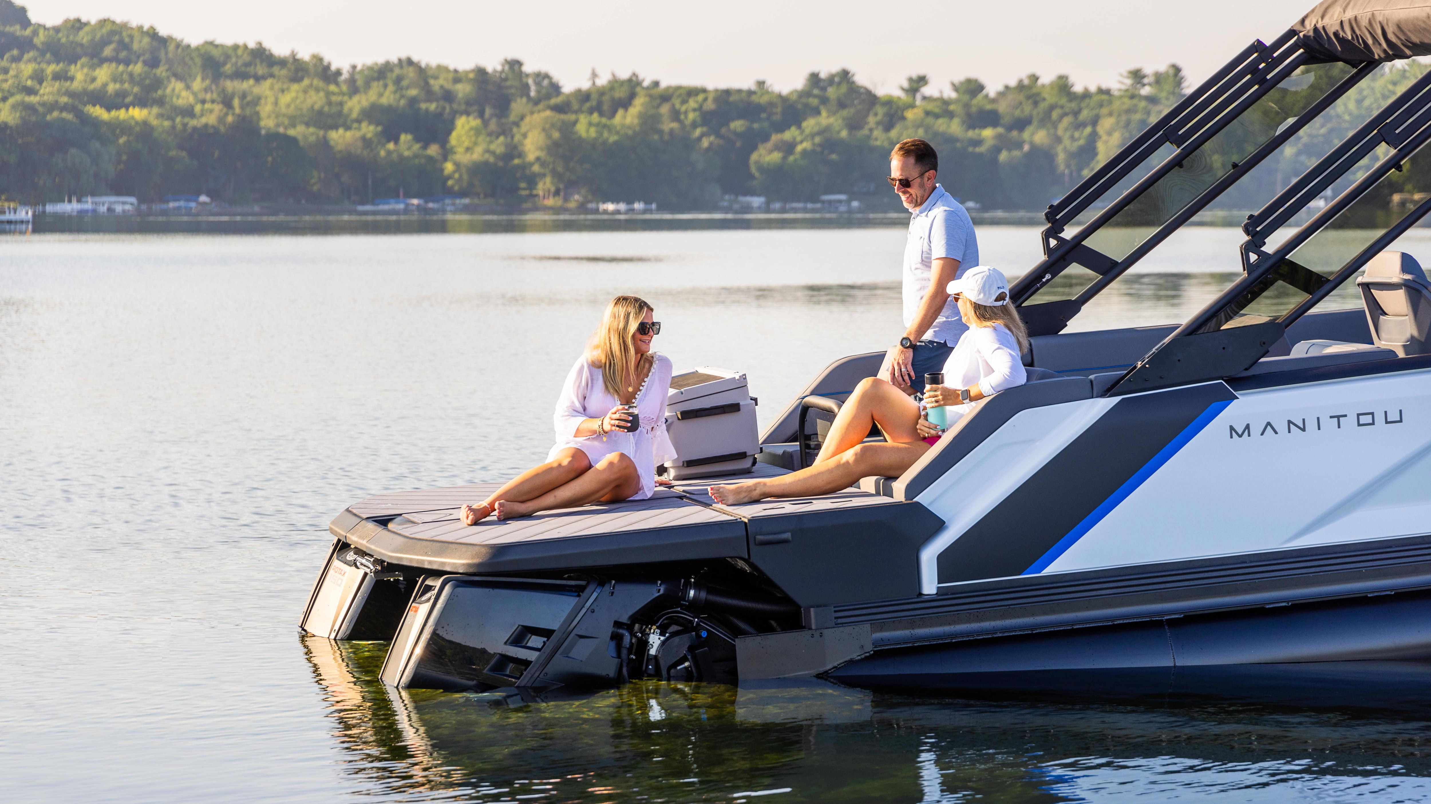 People talking on the MAX Deck of the Manitou Explore pontoon boat