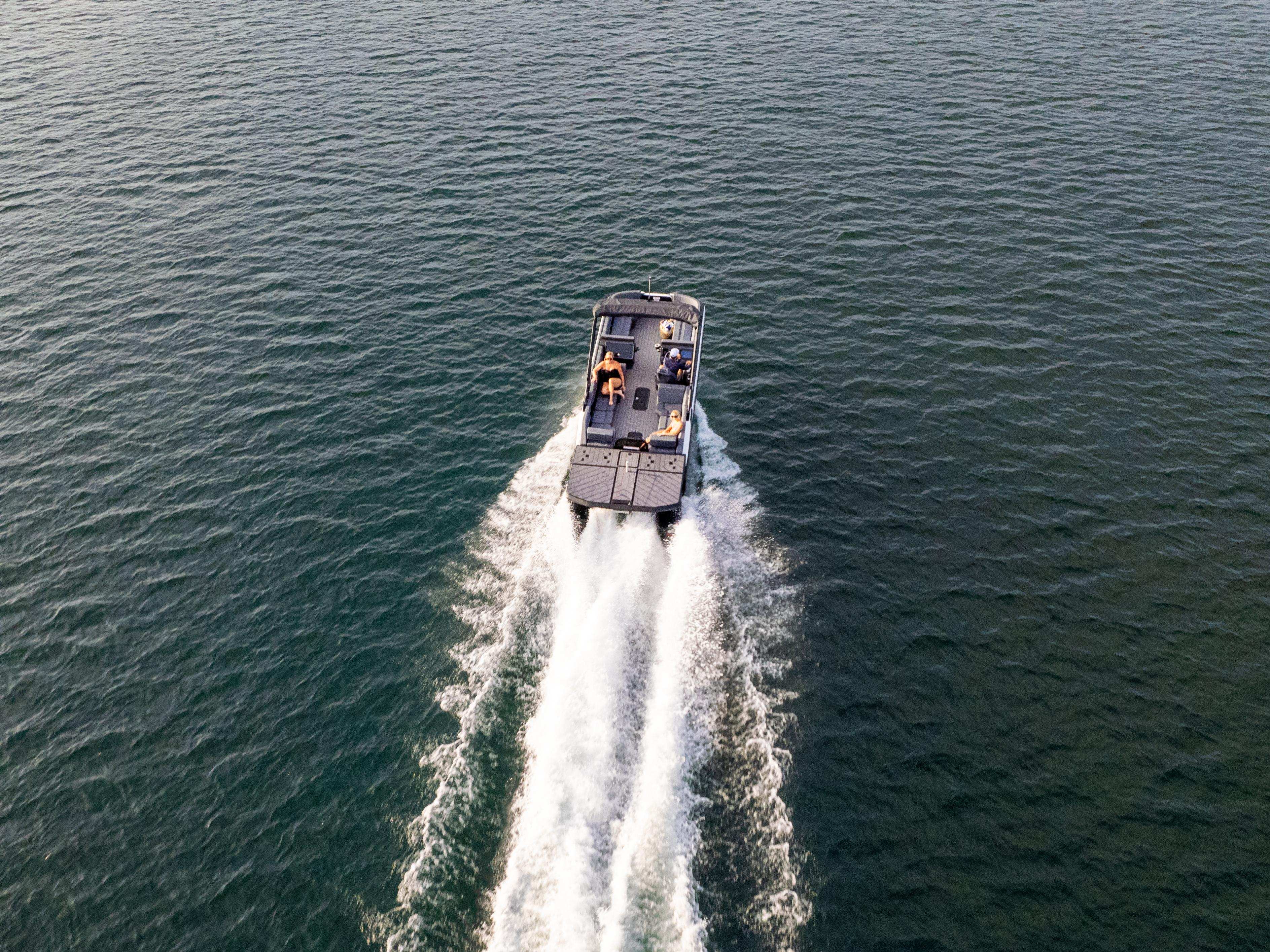 Bird's eye of the 2024 Manitou Explore pontoon on the water