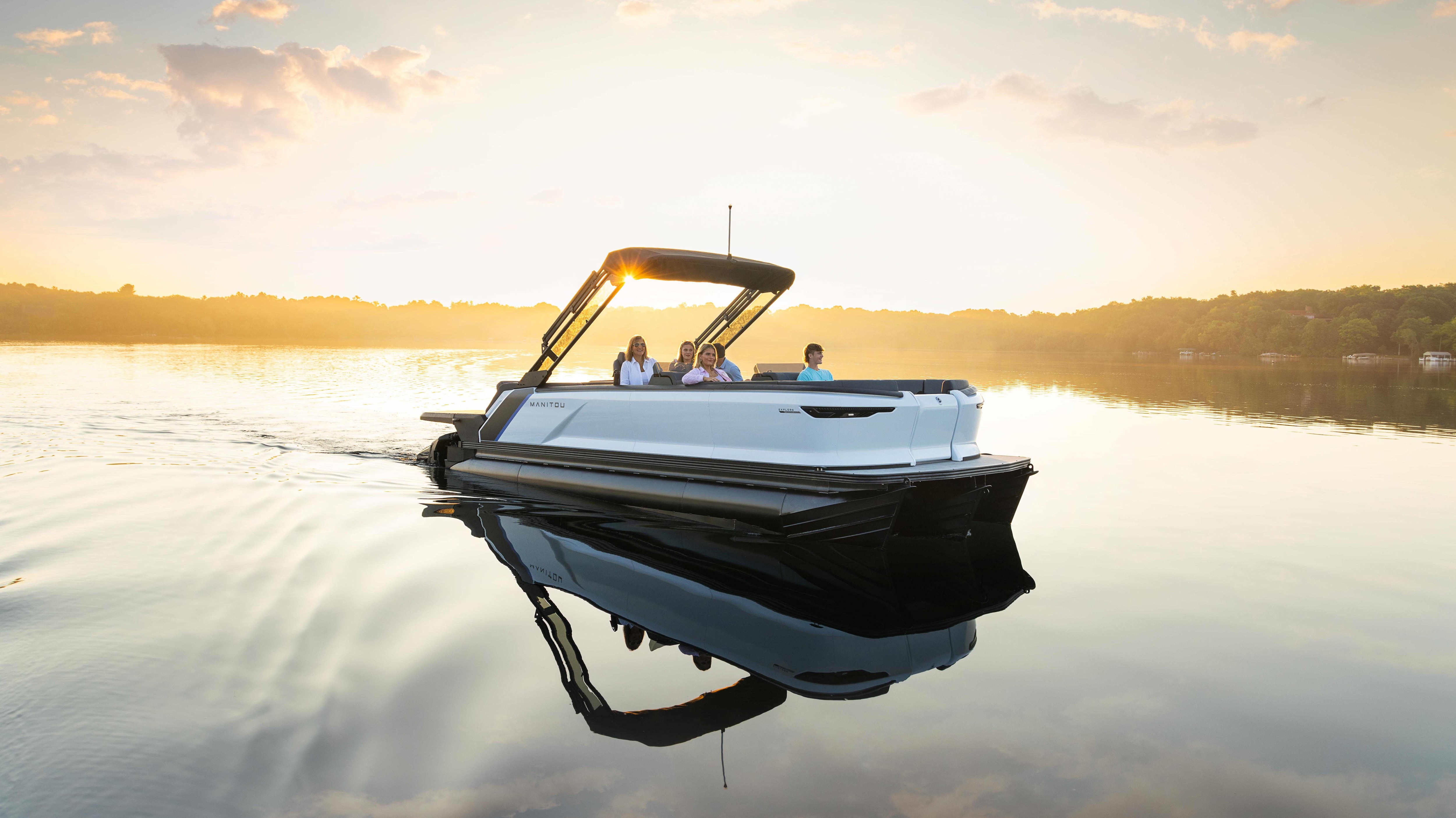 Family riding a 2024 Manitou Explore pontoon